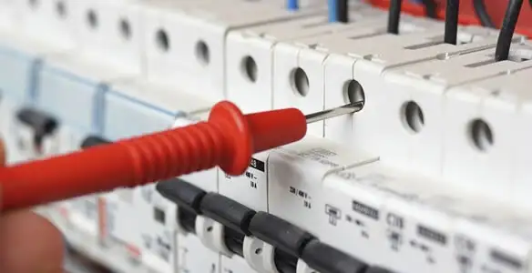 Electrical contractor testing circuit breakers during electrical repair in Stanford, CA