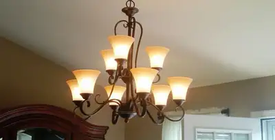 Classic ceiling chandelier installation with warm lighting in Mountain View, CA