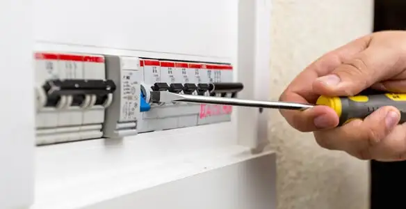electrical panel upgrade service showing technician adjusting circuit breakers during system upgrade in Mountain View, CA