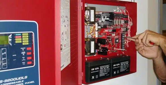 fire alarm installation service showing technician configuring fire alarm control panel in Mountain View, CA