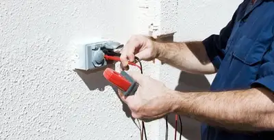 Electrician performing home electrical outlet and wiring inspection in Mountain View, CA