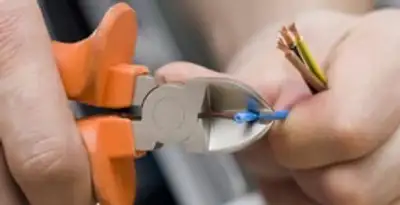 professional electrical services showing precise wire cutting by licensed electricians in Mountain View, CA
