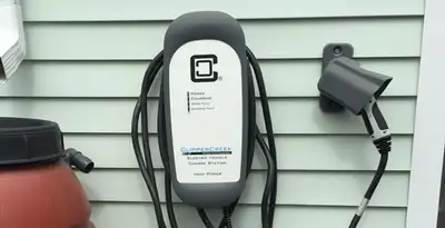 Outdoor electric vehicle charger installation on residential wall in Mountain View, CA