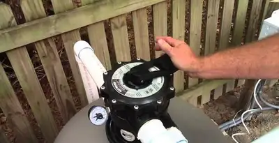 pool pumps service showing professional adjustment of pool pump control system in Mountain View, CA