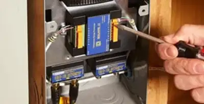 Whole home surge protection device being installed by a licensed electrician to protect electrical systems in Mountain View, CA